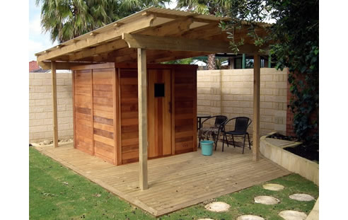 cedar log sauna under pergola