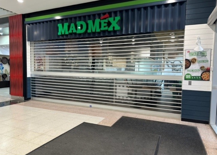Widespan Transparent Roller Shutters for Mad Mex Store Front by ATDC