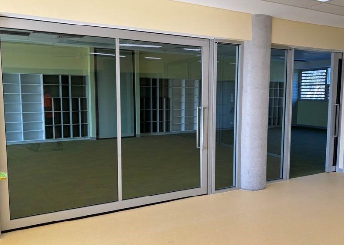 Glazed Acoustic Sliding Doors for Educational Buildings by Bildspec