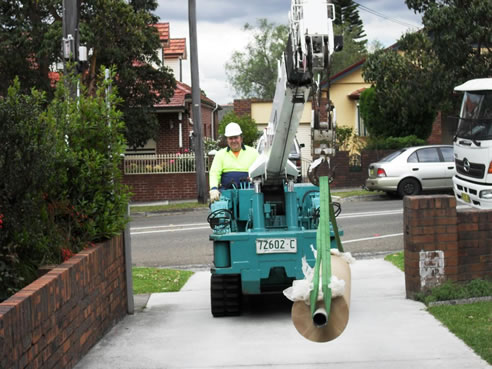 mini crawler crane in driveway