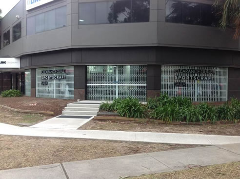 concertina trellis security door at apparel group store