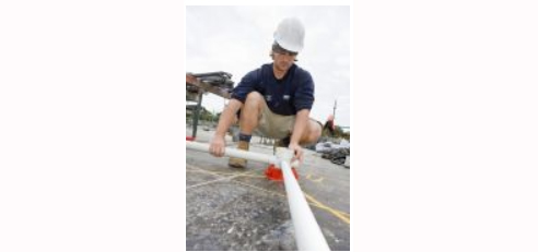 man with plastic pipe