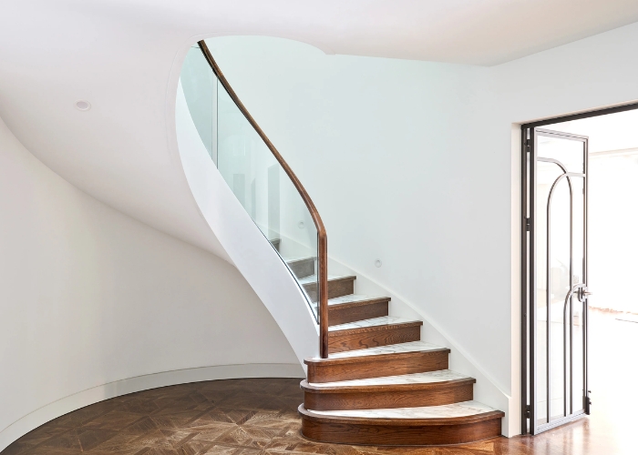 Winding Staircase with Curved Glass Balustrade by S&A Stairs