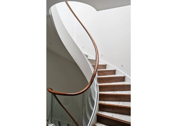 Winding Staircase with Curved Glass Balustrade by S&A Stairs