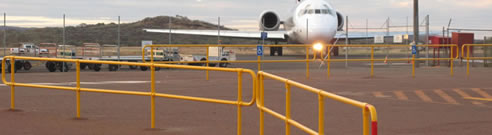 yellow pedestrian barriers at airport